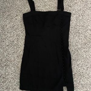 Black mini dress with button detailing down the side
